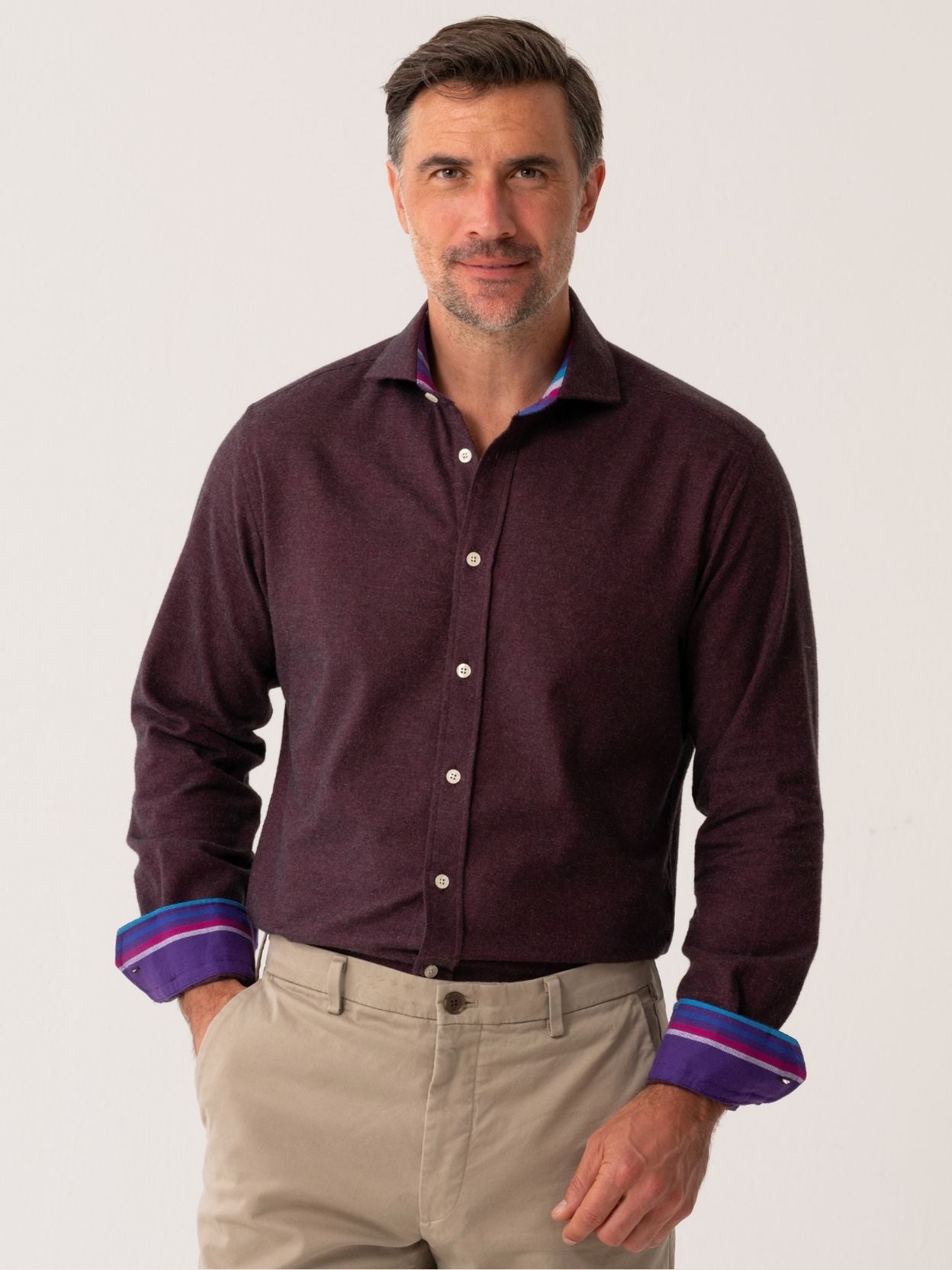 Man wearing a dark Burgundy Cotton-Cashmere shirt with rolled-up sleeves on a white background