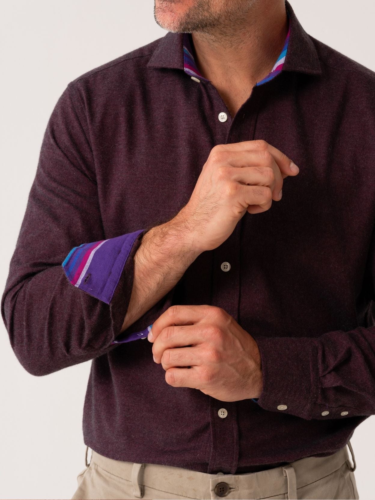 Man wearing a dark Burgundy Cotton-Cashmere shirt with rolled-up sleeves on a white background