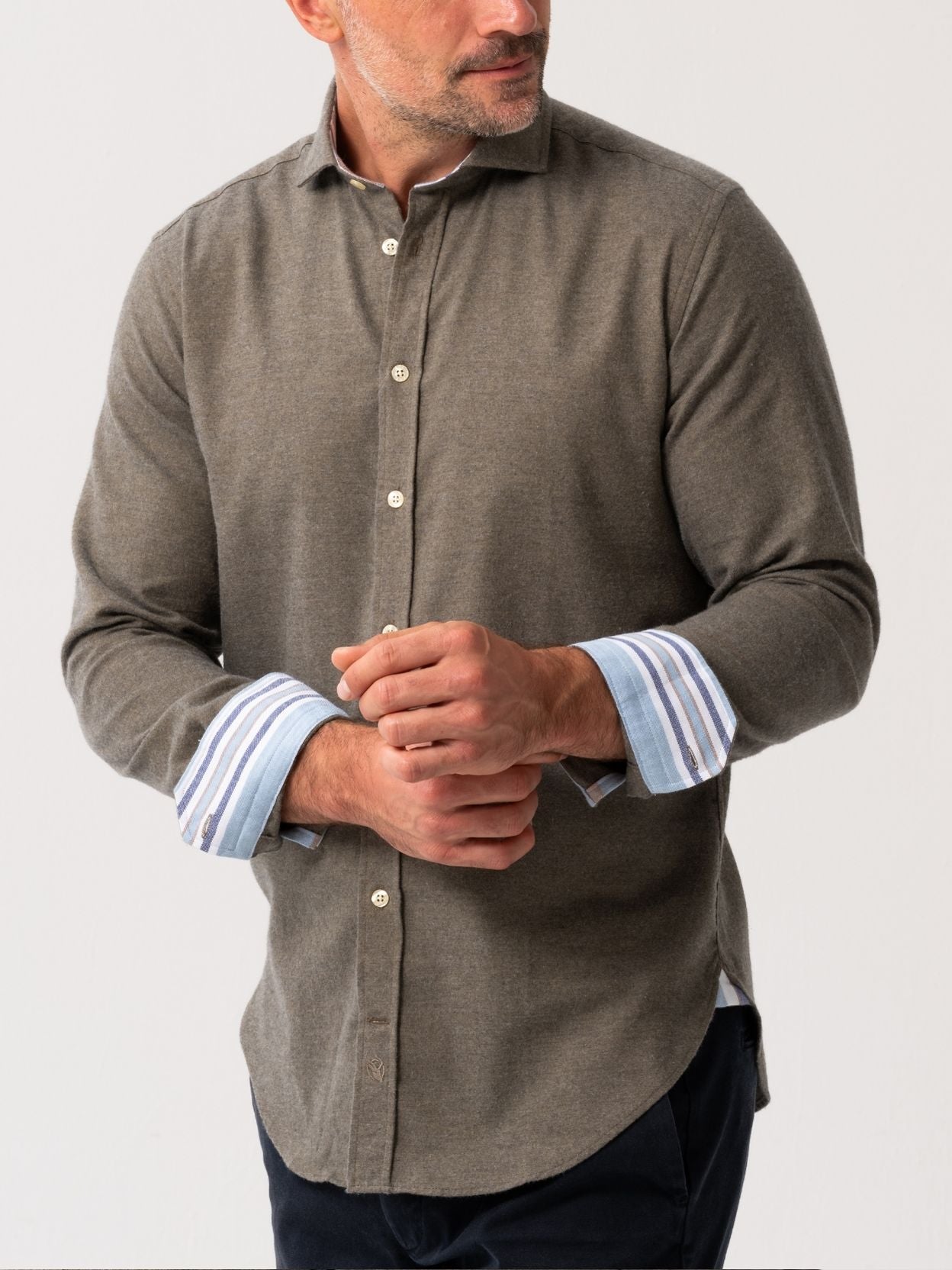 Man wearing an Olive Cotton-Cashmere Shirt with striped cuffs on a white background