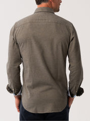 Man wearing an Olive Cotton-Cashmere shirt from behind on a white background
