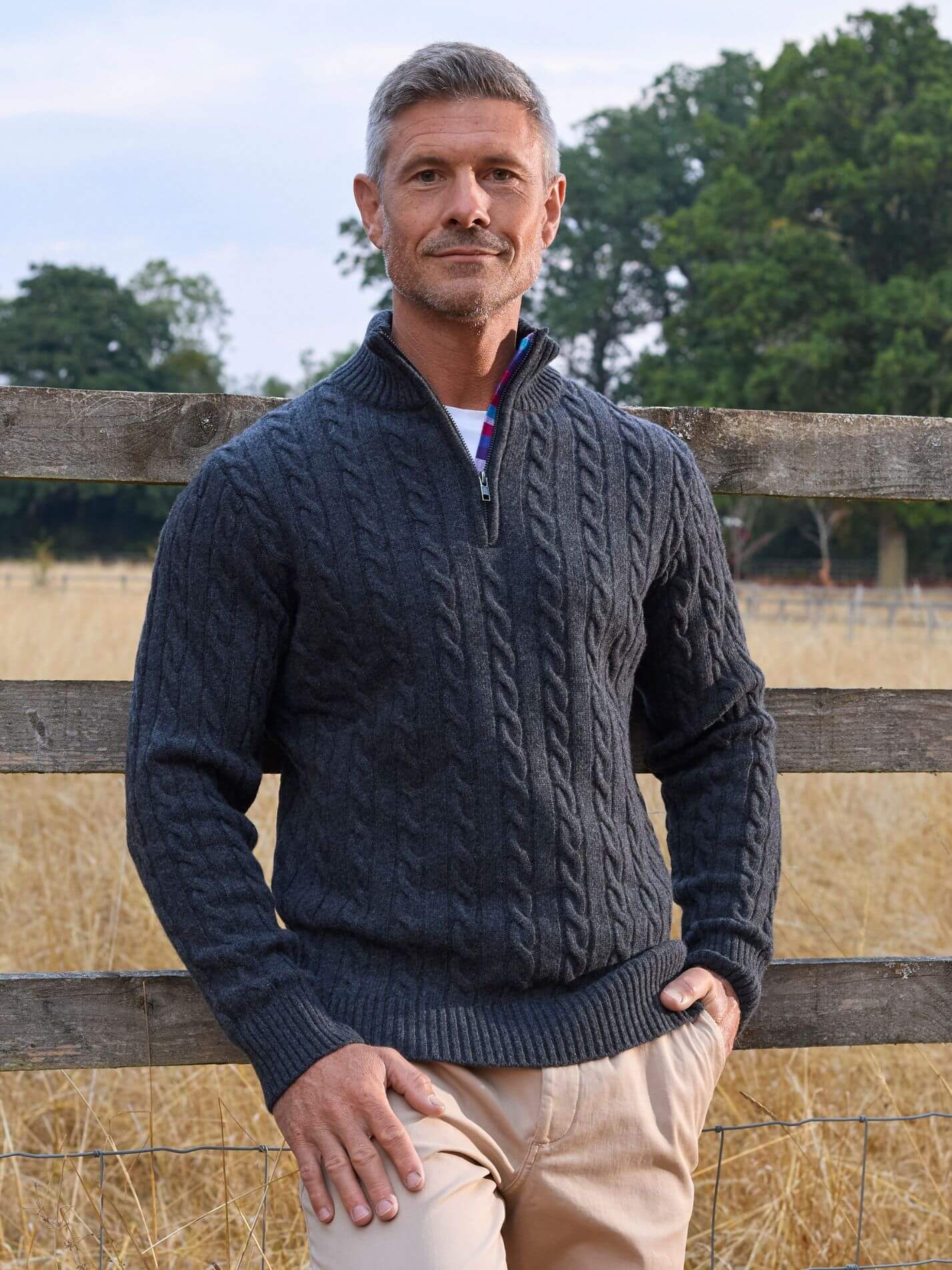 Charcoal cable knit quarter-zip jumper in Merino wool and cashmere, with Kenyan Kikoy trim inside the collar