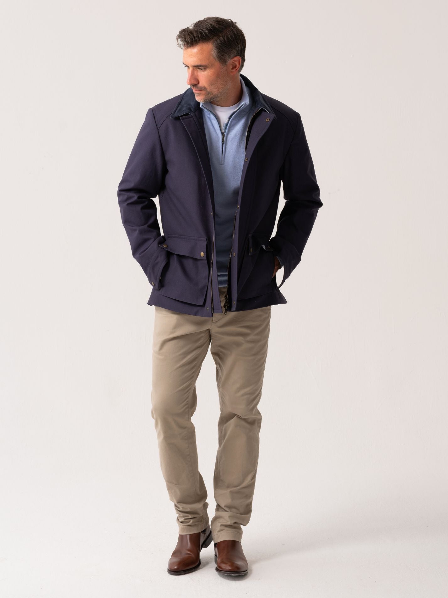 Mens navy outerwear coat with water resistant finish - full body front view on plain background 