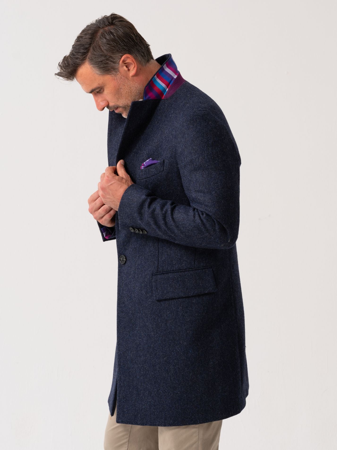 Side view of men’s navy wool overcoat