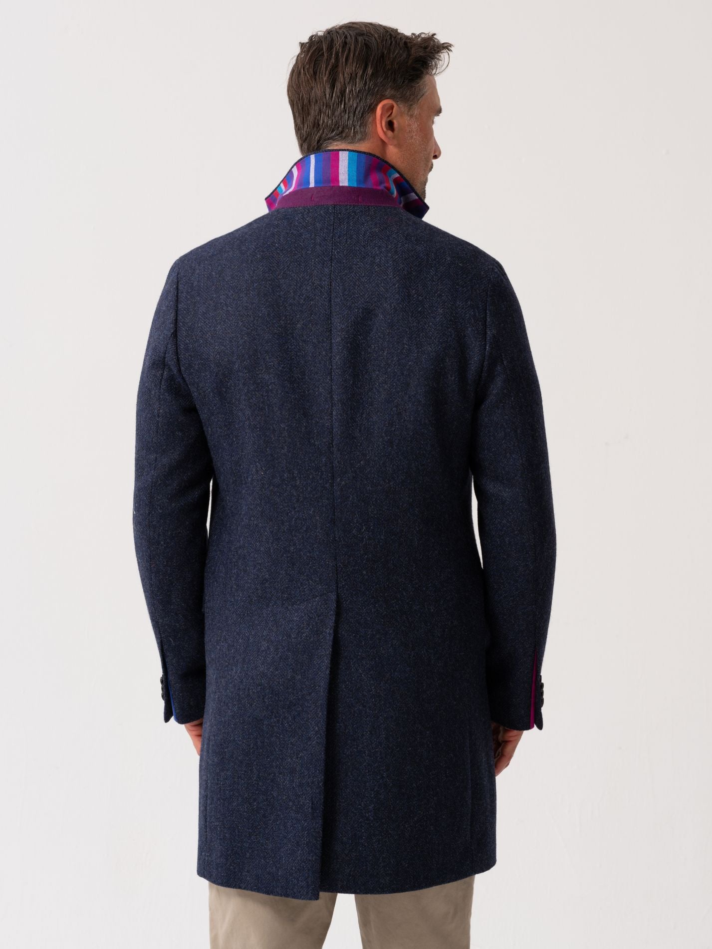 Back view of men’s navy wool overcoat