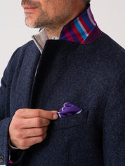 Close-up of notch lapel on navy wool overcoat