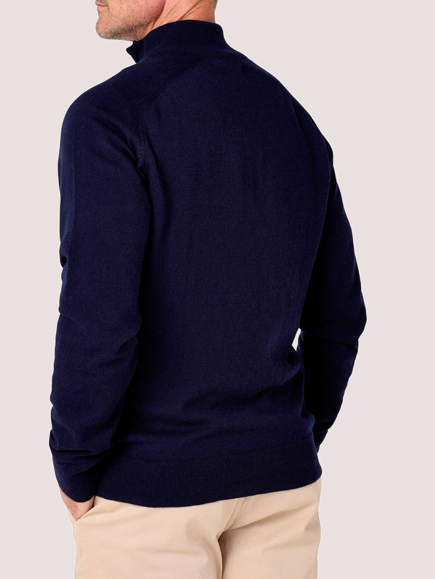 Dark Navy quarter-zip jumper in 100% Merino wool, with Kenyan Kikoy trim inside the collar