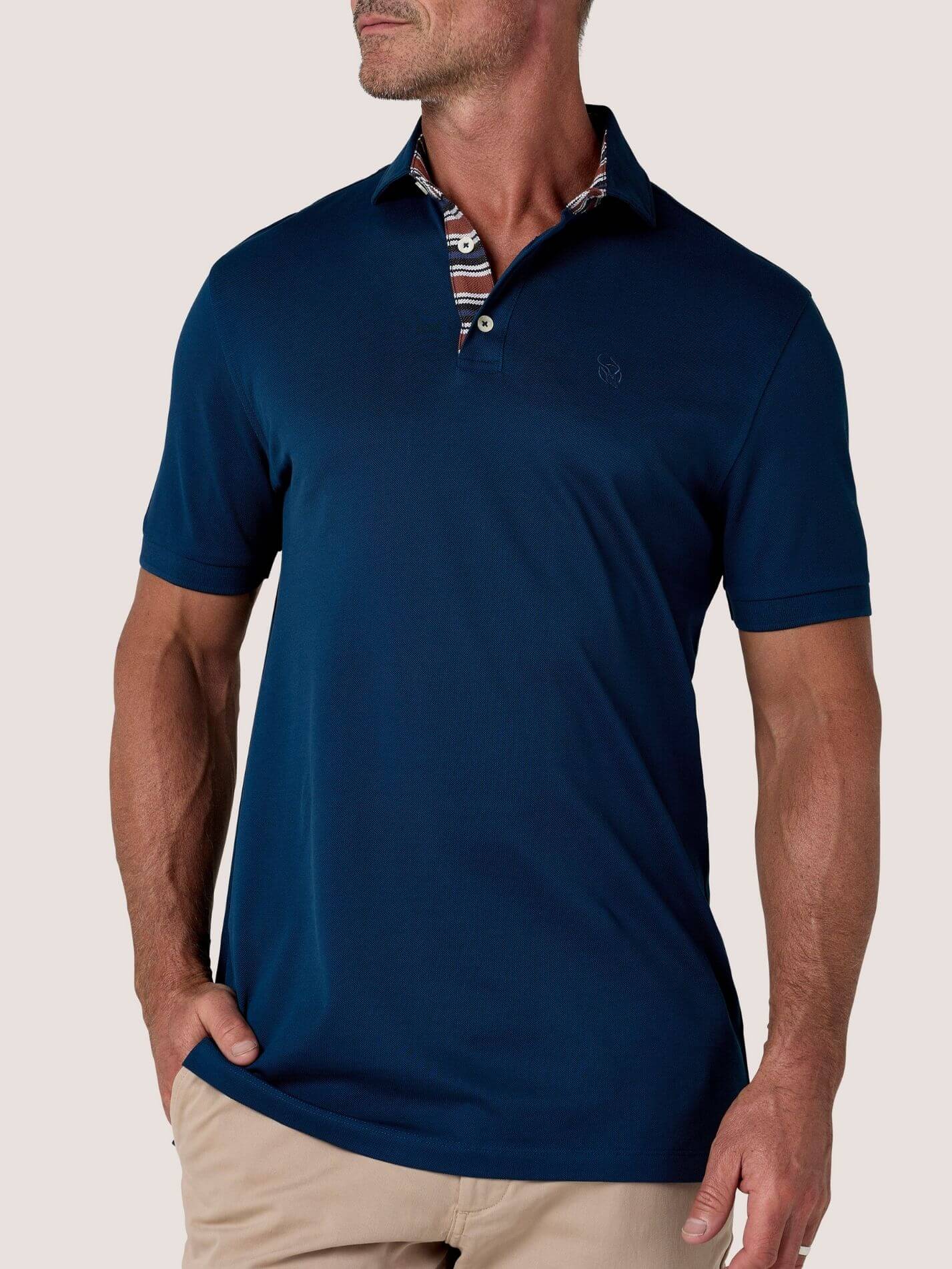 Navy short-sleeve Cotton Piqué polo shirt, Kenyan Kikoy trim on the front placket and collar