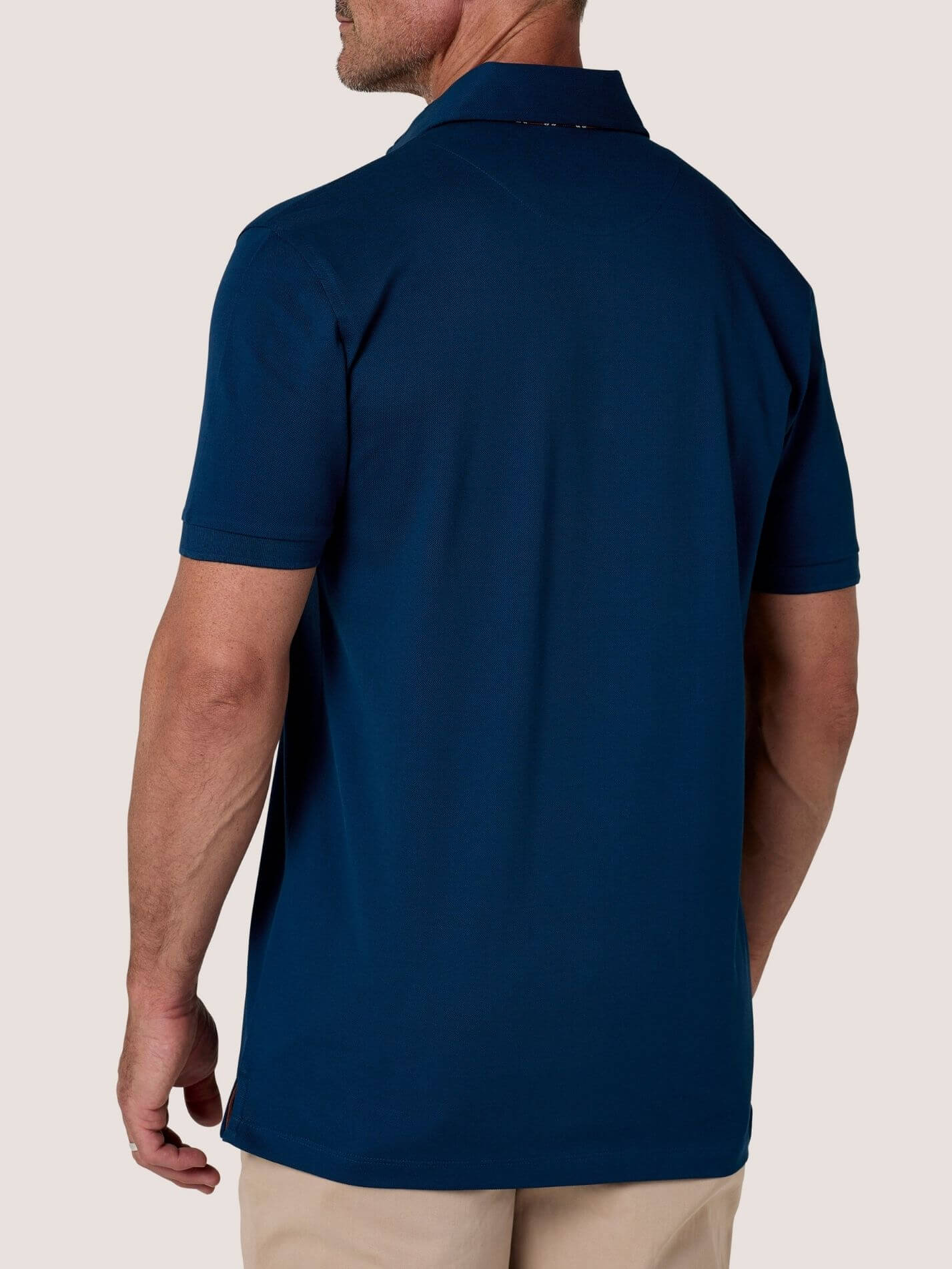 Navy short-sleeve Cotton Piqué polo shirt, Kenyan Kikoy trim on the front placket and collar