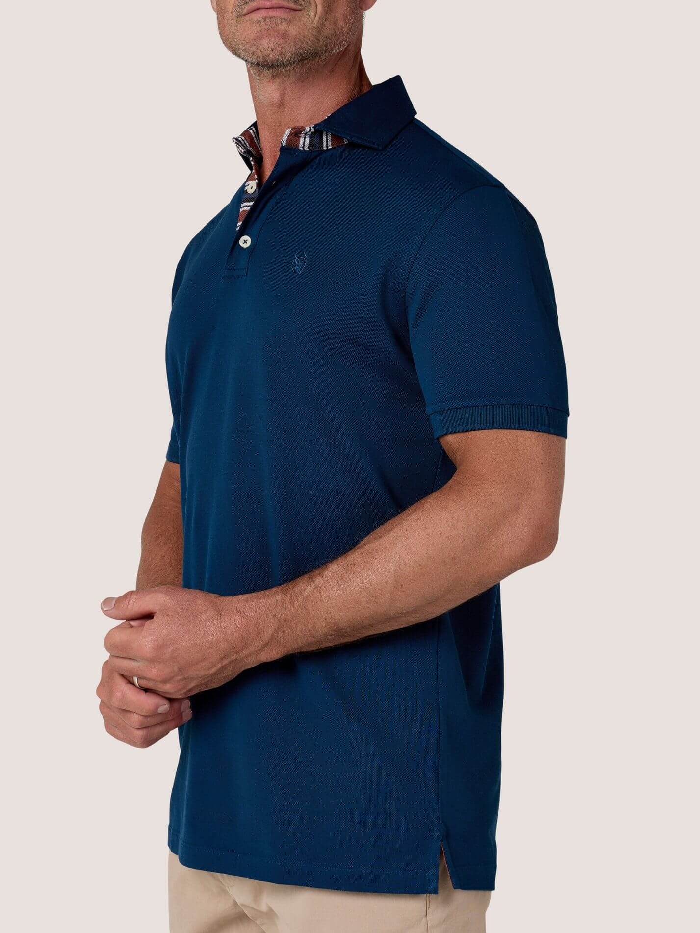Navy short-sleeve Cotton Piqué polo shirt, Kenyan Kikoy trim on the front placket and collar