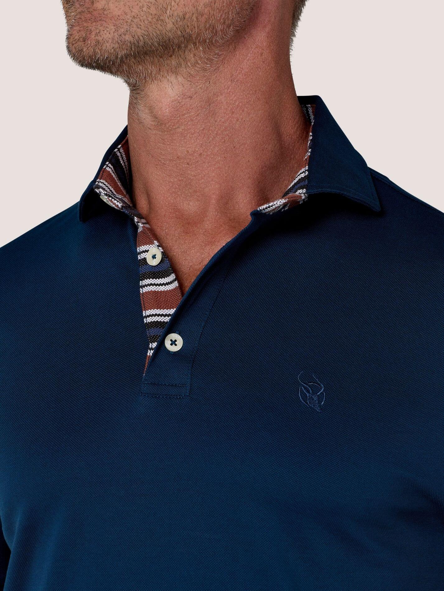 Navy short-sleeve Cotton Piqué polo shirt, Kenyan Kikoy trim on the front placket and collar