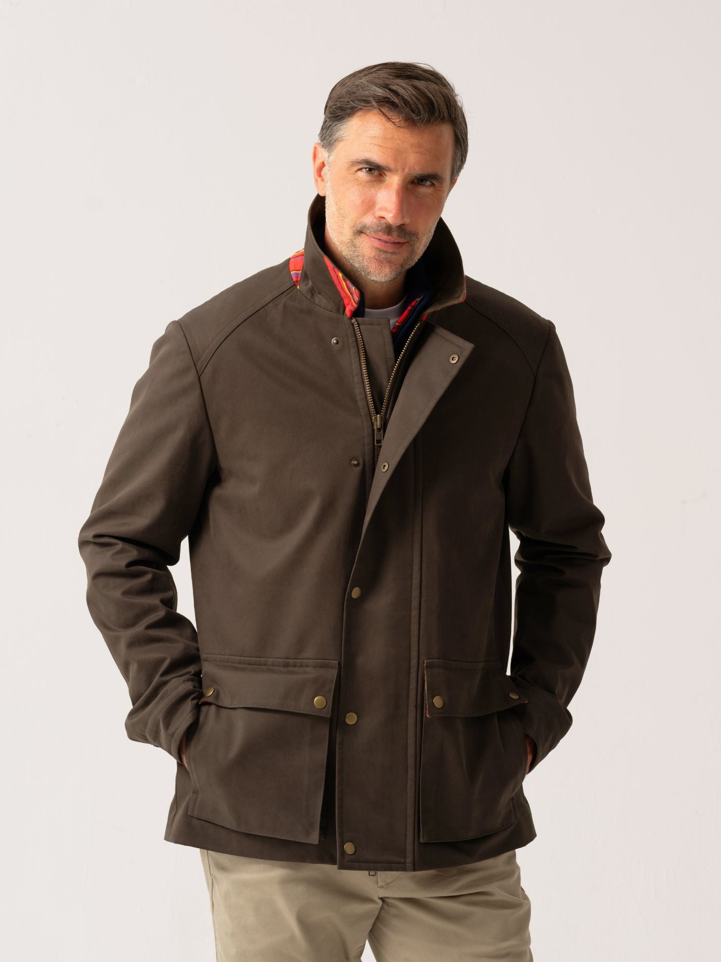 Mens outerwear coat in Dark Olive with water resistant finish - front view on plain background 