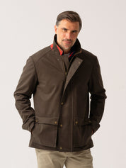 Mens outerwear coat in Dark Olive with water resistant finish - front view on plain background 
