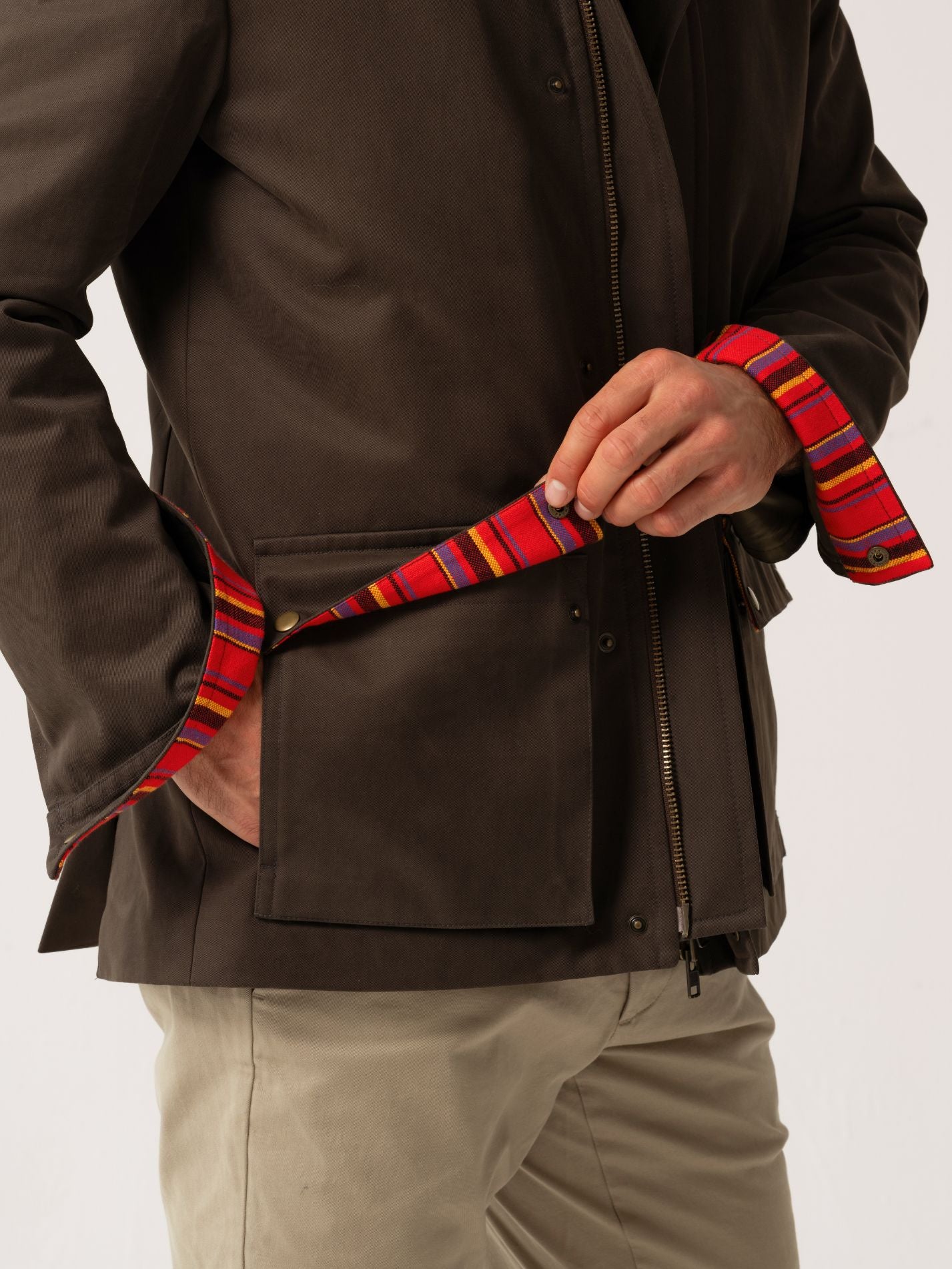 Mens outerwear coat in Dark Olive with African fabric detail under pocket flaps and cuffs