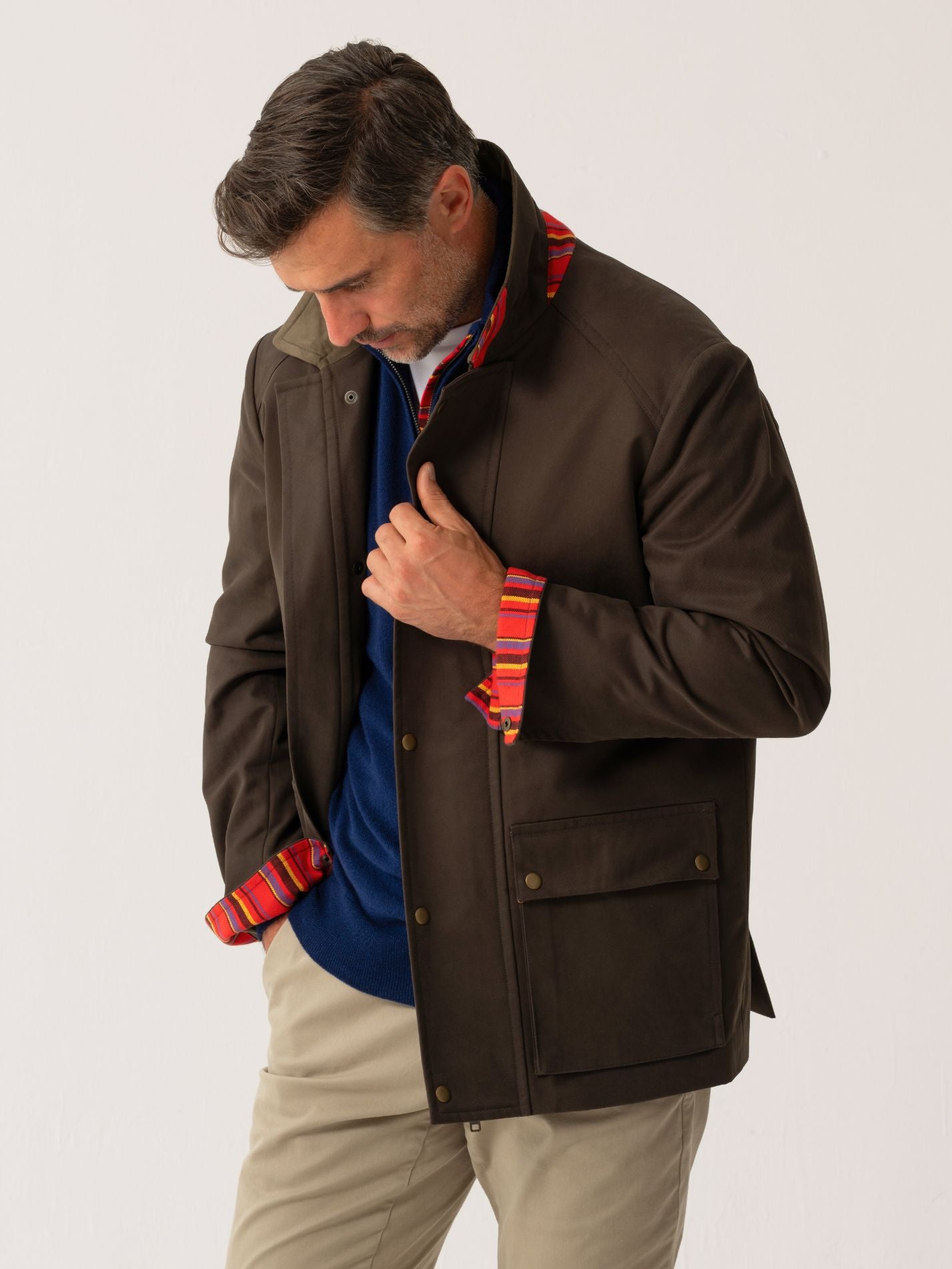 Mens outerwear coat in Dark Olive with African fabric detail - front view on plain background 