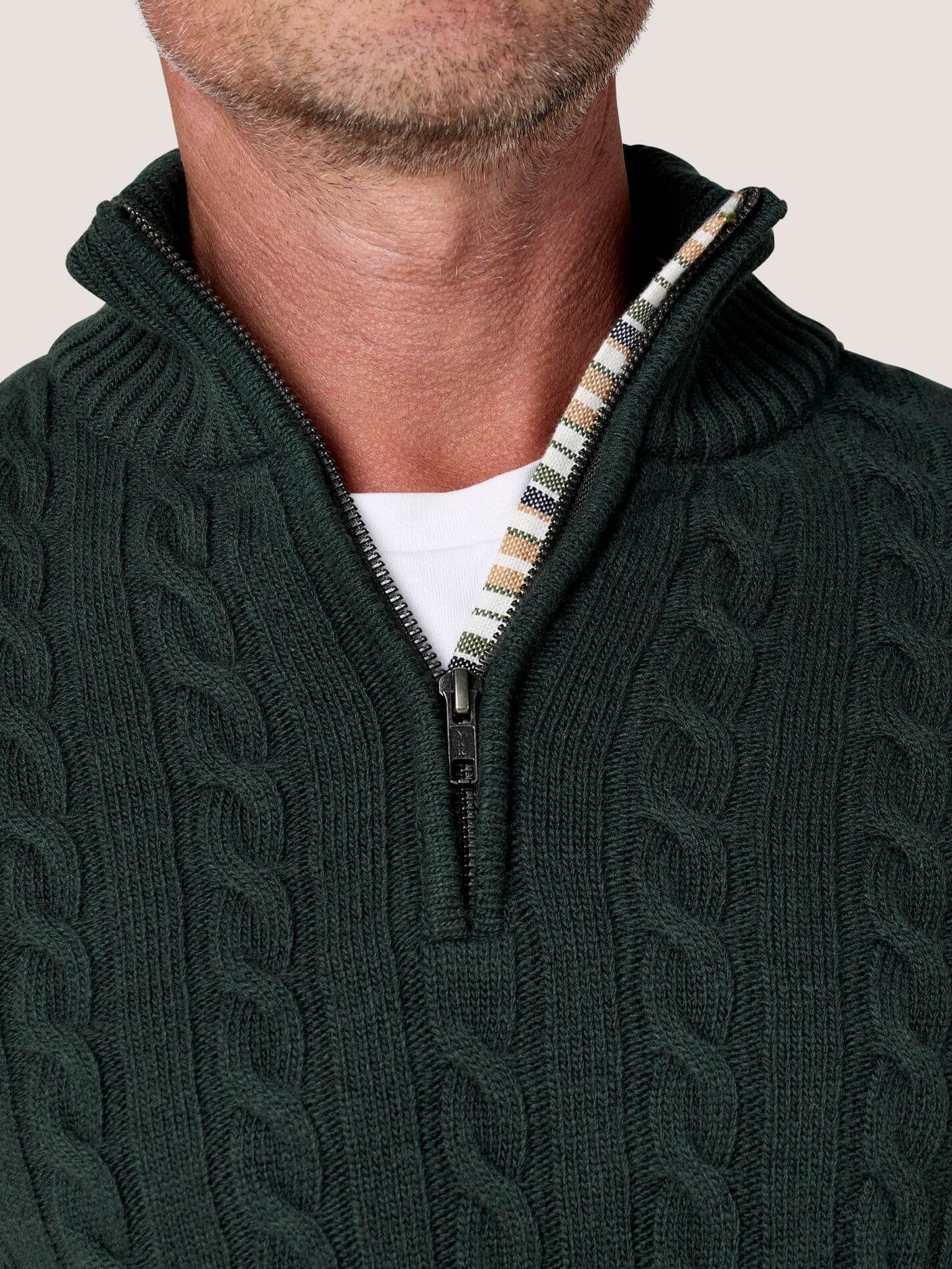 Pine Green cable knit quarter-zip jumper in Merino wool and cashmere, with Kenyan Kikoy trim inside the collar