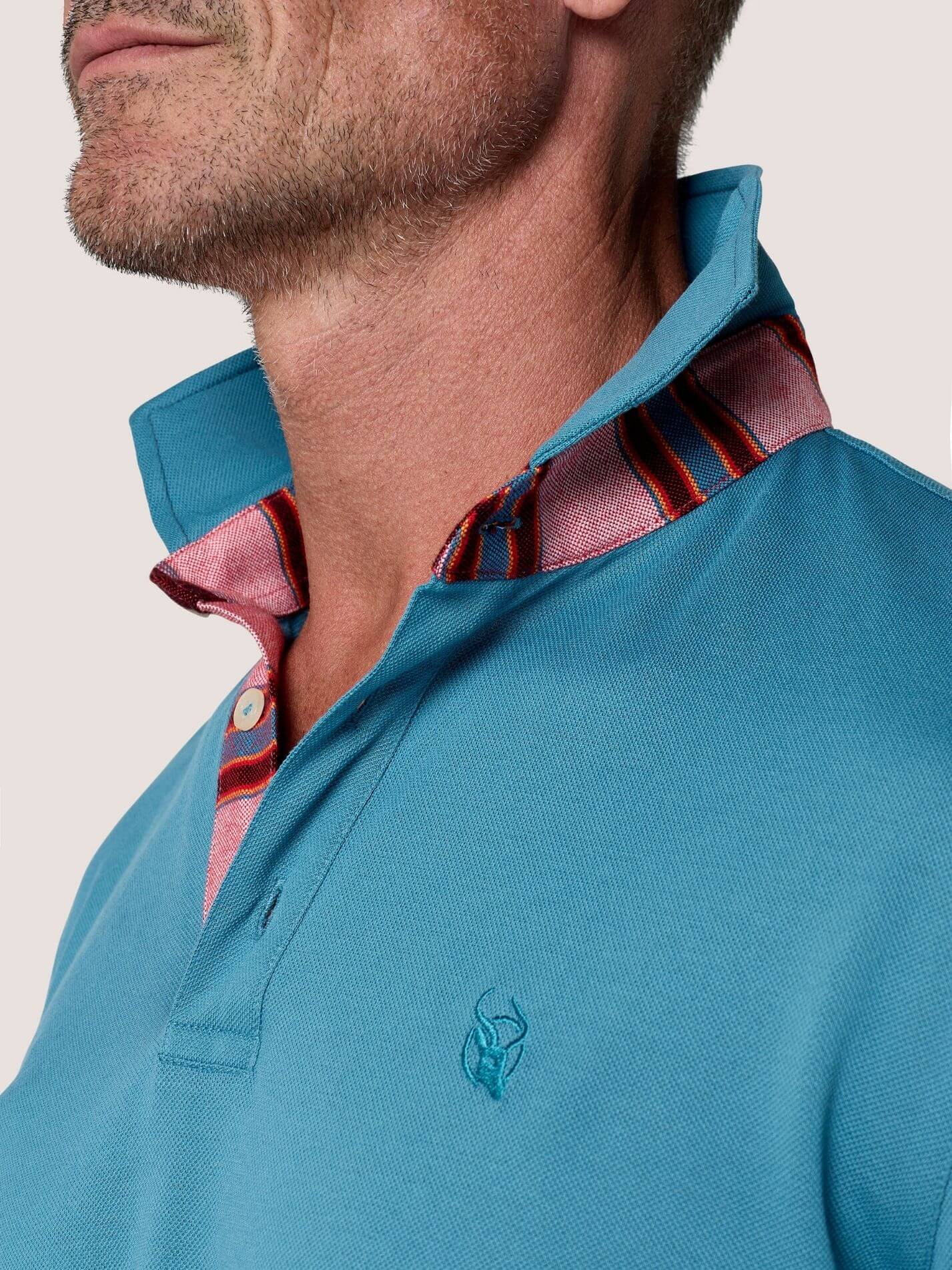 Slate Blue long-sleeve Cotton Piqué polo shirt, Kenyan Kikoy trim on the front placket, cuffs and collar