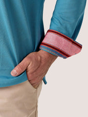 Slate Blue long-sleeve Cotton Piqué polo shirt, Kenyan Kikoy trim on the front placket, cuffs and collar