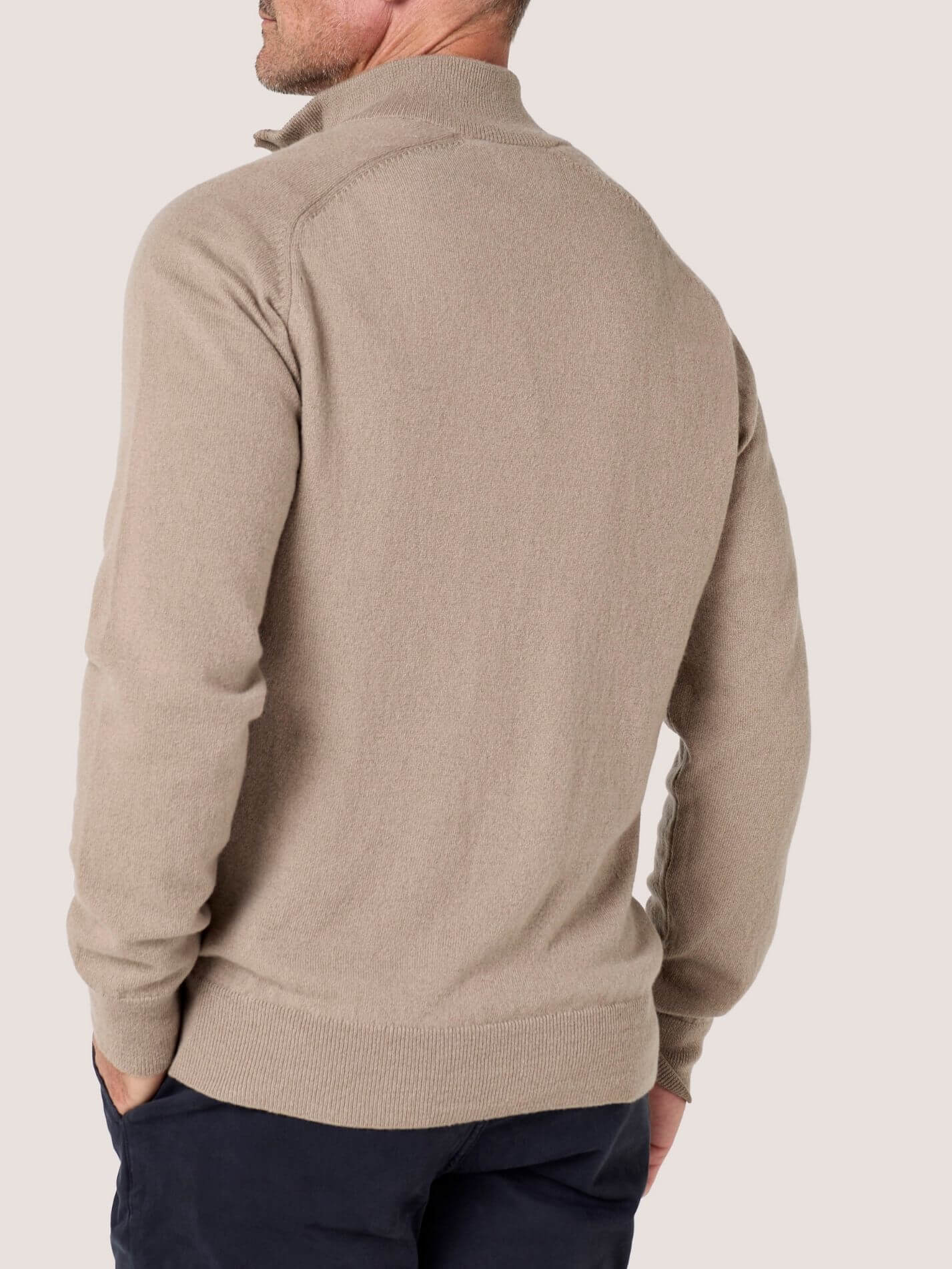 Stone quarter-zip jumper in 100% Merino wool, with Kenyan Kikoy trim inside the collar