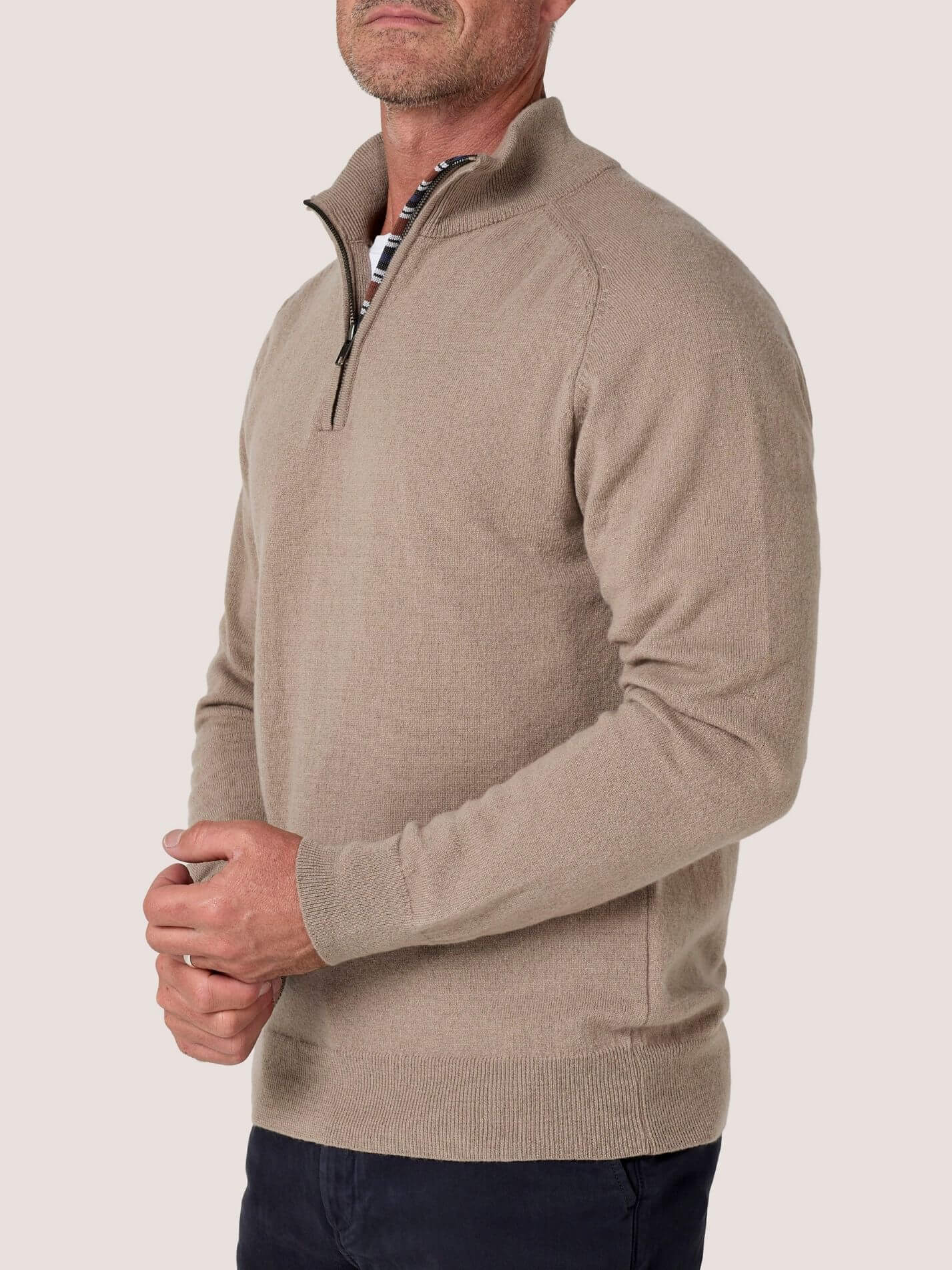 Stone quarter-zip jumper in 100% Merino wool, with Kenyan Kikoy trim inside the collar