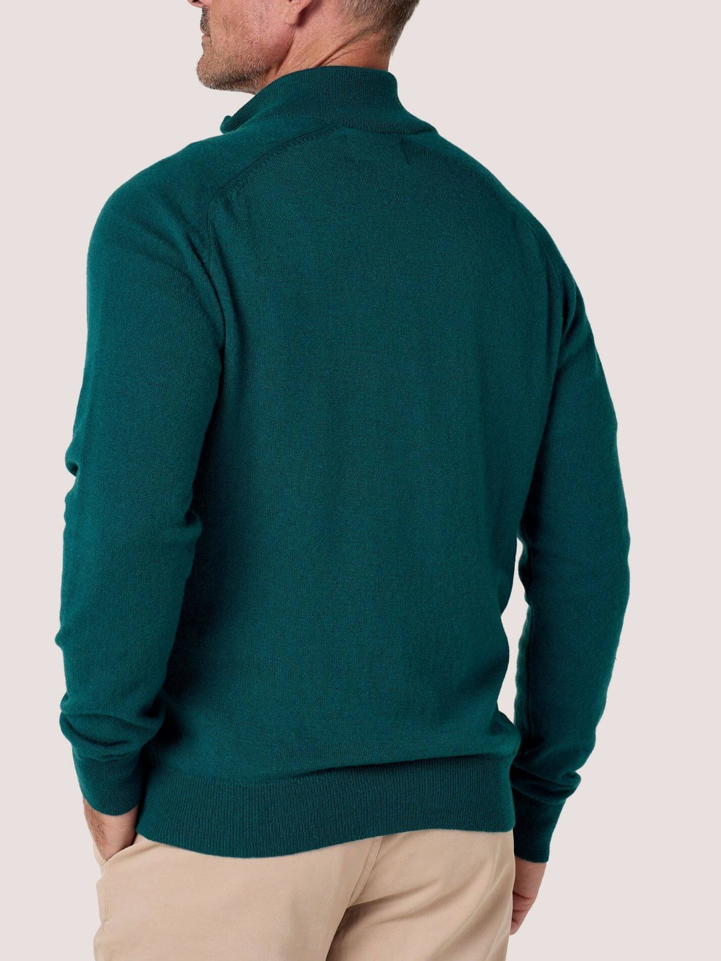Teal quarter-zip jumper in 100% Merino wool, with Kenyan Kikoy trim inside the collar