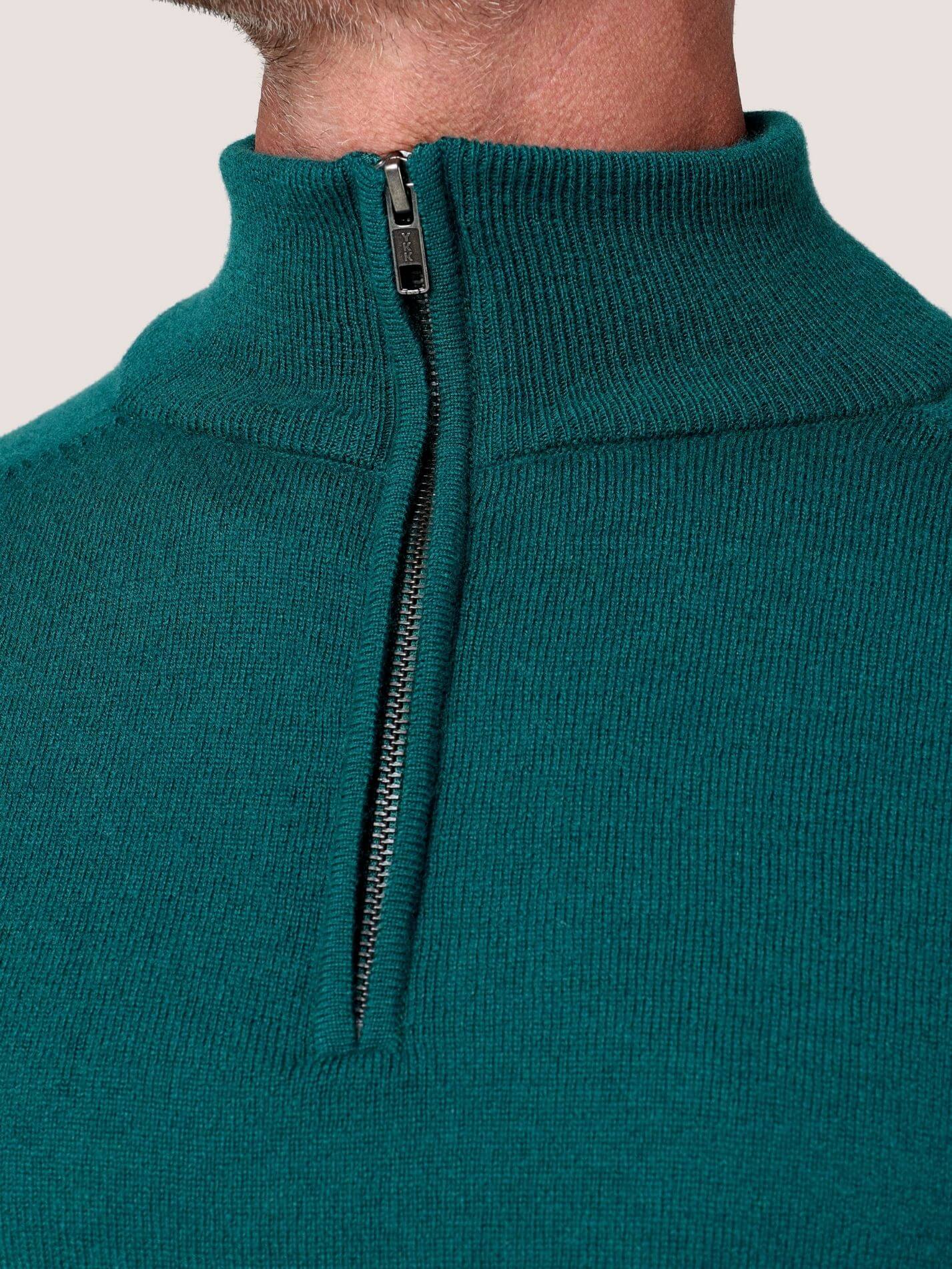 Teal quarter-zip jumper in 100% Merino wool, with Kenyan Kikoy trim inside the collar