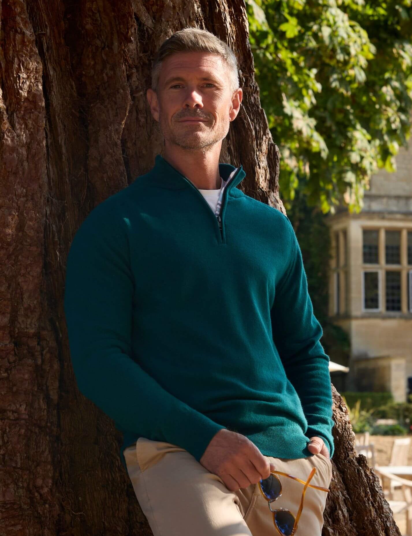 Teal quarter-zip jumper in 100% Merino wool, with Kenyan Kikoy trim inside the collar