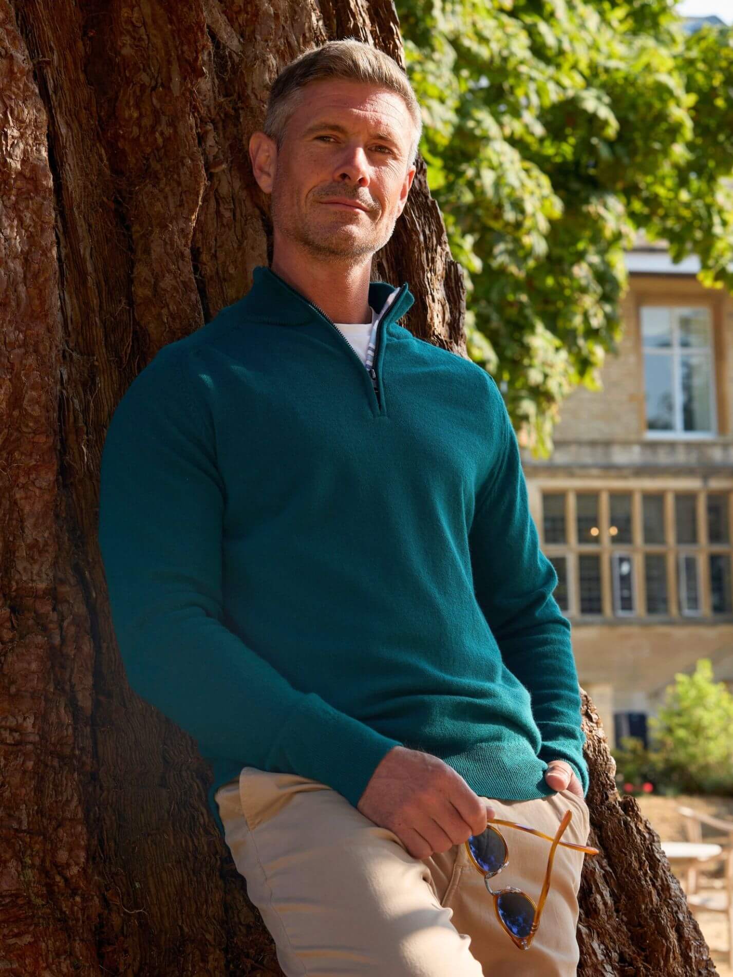 Teal quarter-zip jumper in 100% Merino wool, with Kenyan Kikoy trim inside the collar