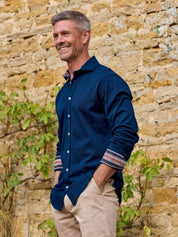 Navy Cotton Piqué shirt with cutaway collar, Kenyan Kikoy trim inside the collar, cuffs and side gusset