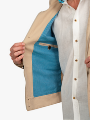 Ranger JacketThe Ranger Jacket by Koy Clothing. This is a beige bomber jacket with blue and white mottled Kenyan Kikoy fabric trim.