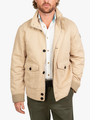 The Ranger Jacket by Koy Clothing. This is a beige bomber jacket with blue and white mottled Kenyan Kikoy fabric trim.